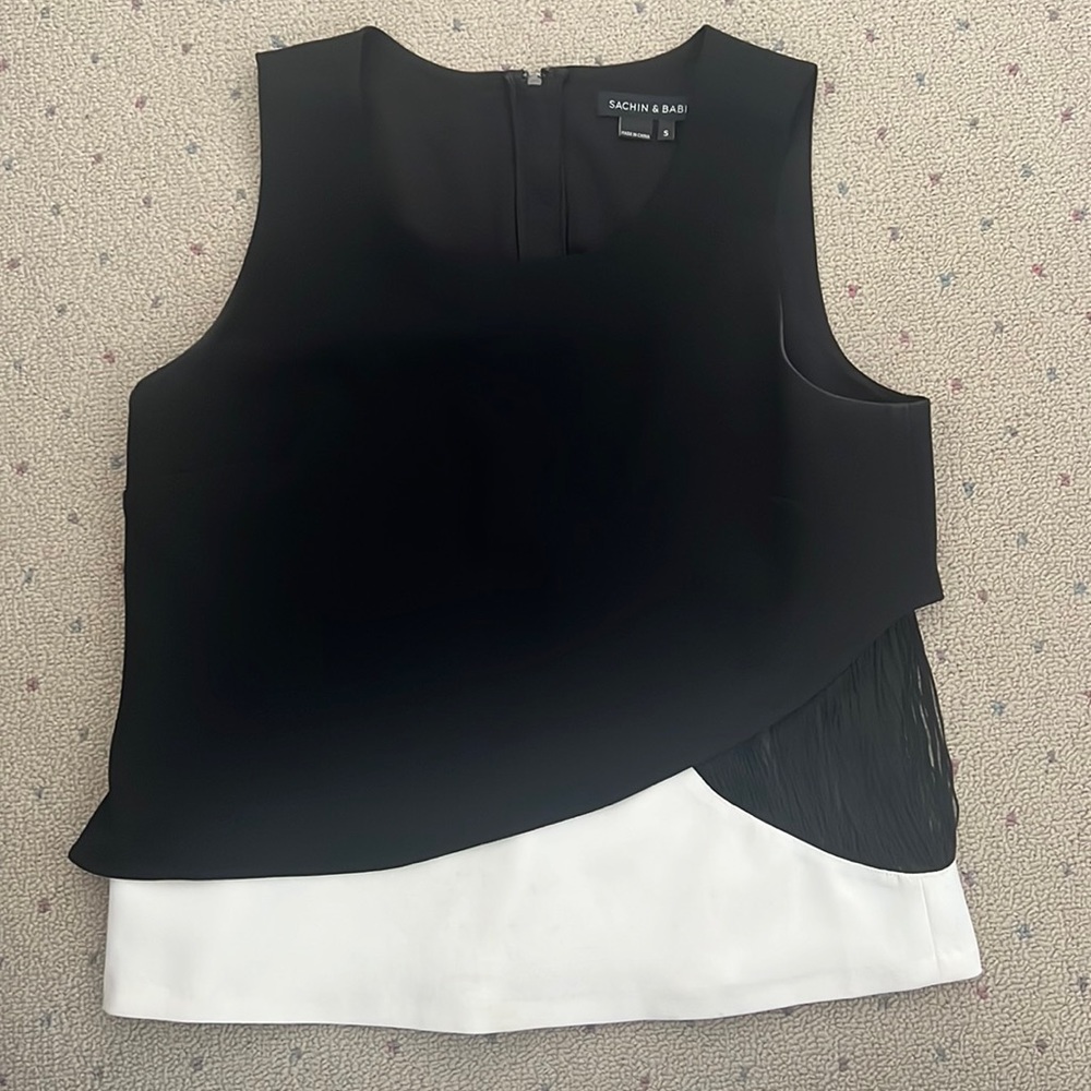 Sachin and Babi black and white top with fringe.